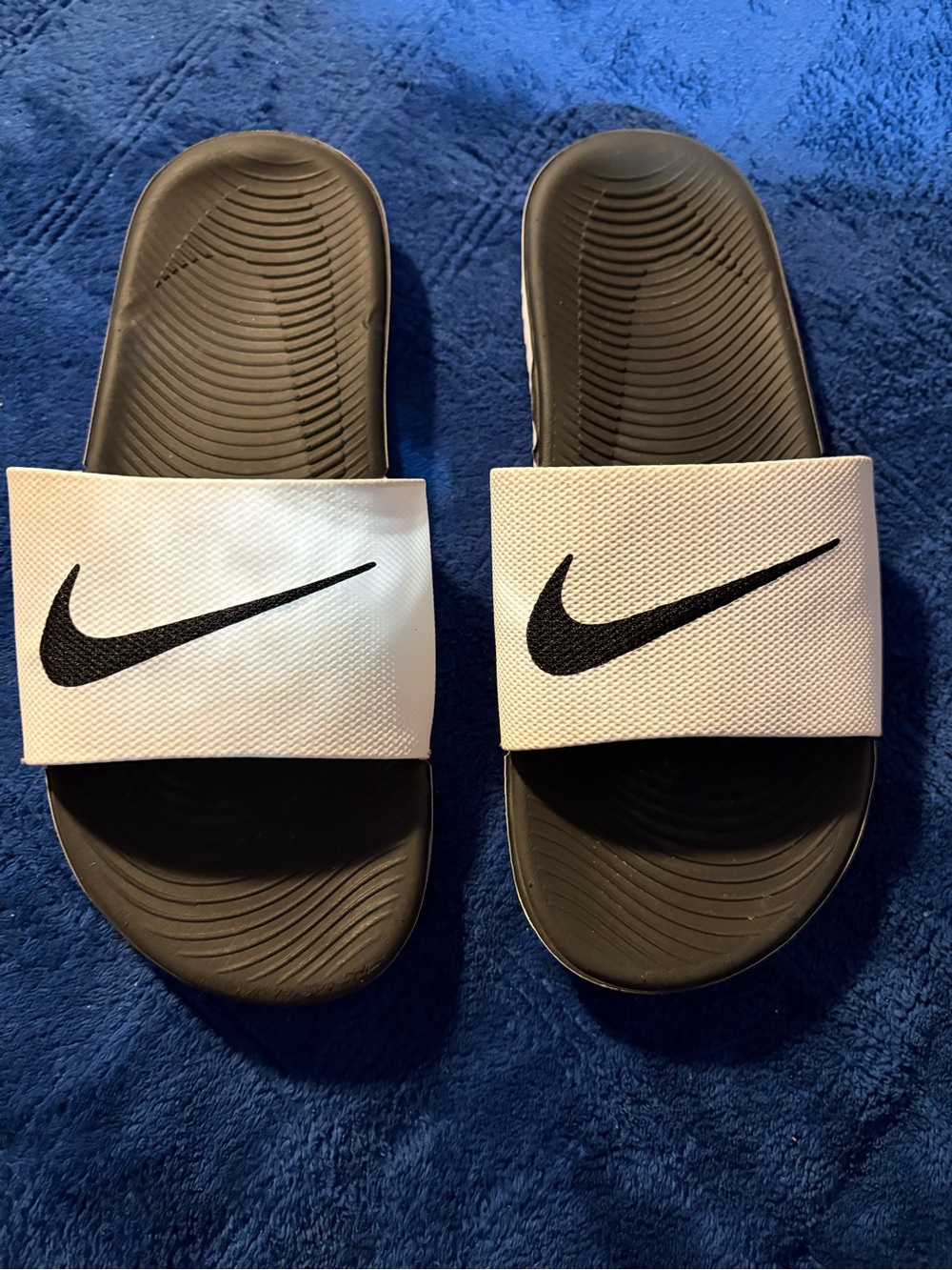 Nike slide sandals in white and black